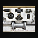 Close up of the Mac Tools PS958 slide hammer, cone, three way puller head and cross nut block stamped MAC PS958