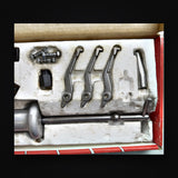 Close up of the Mac Tools PS958 puller jaws, hex cap screws, vise grip adapter and puller hook in the tray