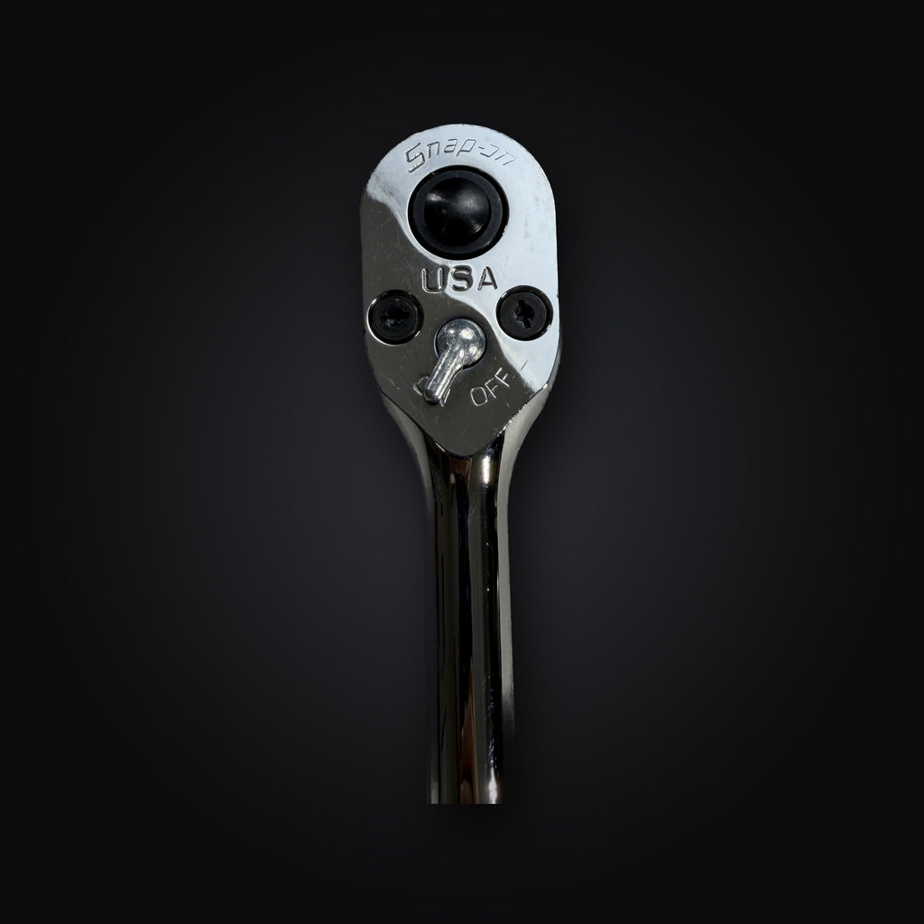 Close-up of the Snap-on SR80A ratchet head showing the Snap-on logo, USA stamping and the OFF direction lever